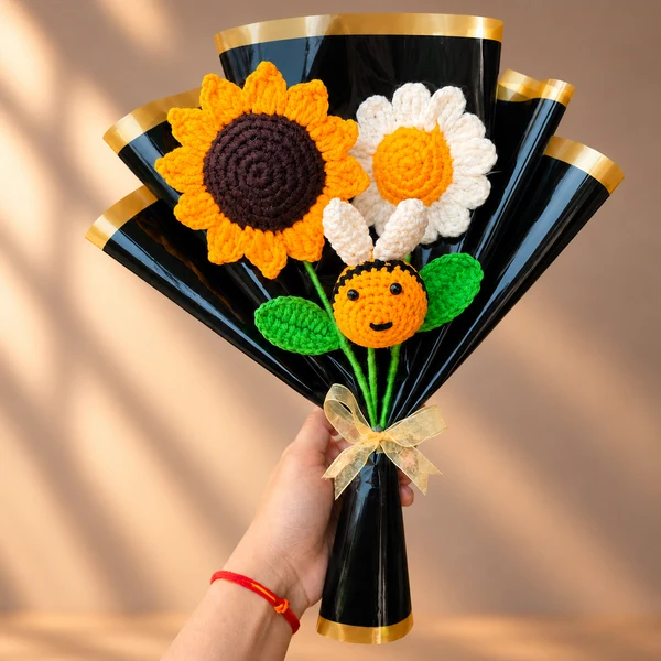 Crochet bouquet of a sunflower, a daisy and a smiling bee